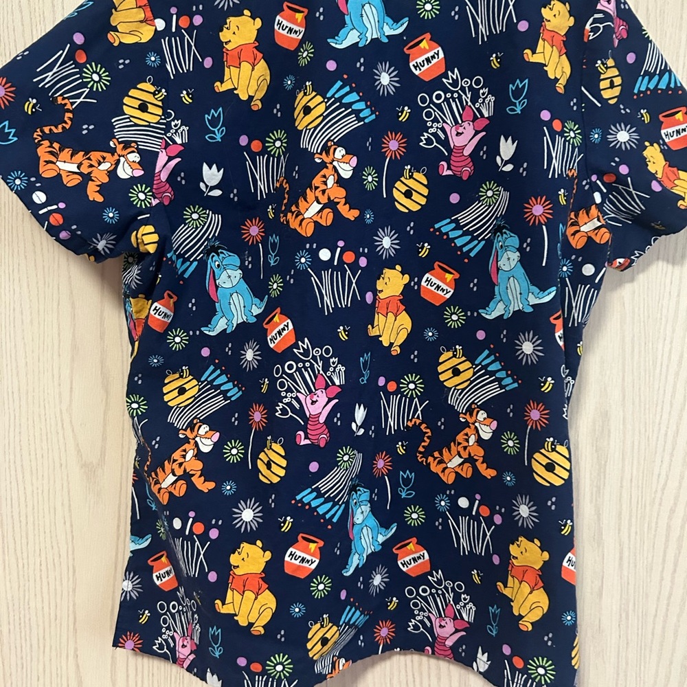 Disney Navy scrub top with Multicolor Winnie the Pooh Characters